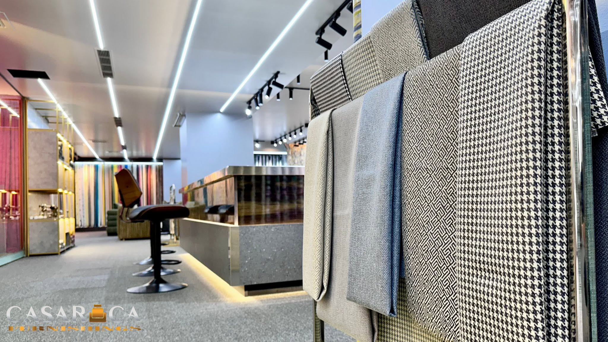 Casarica fabric display with patterned samples, photograph supplied by the user